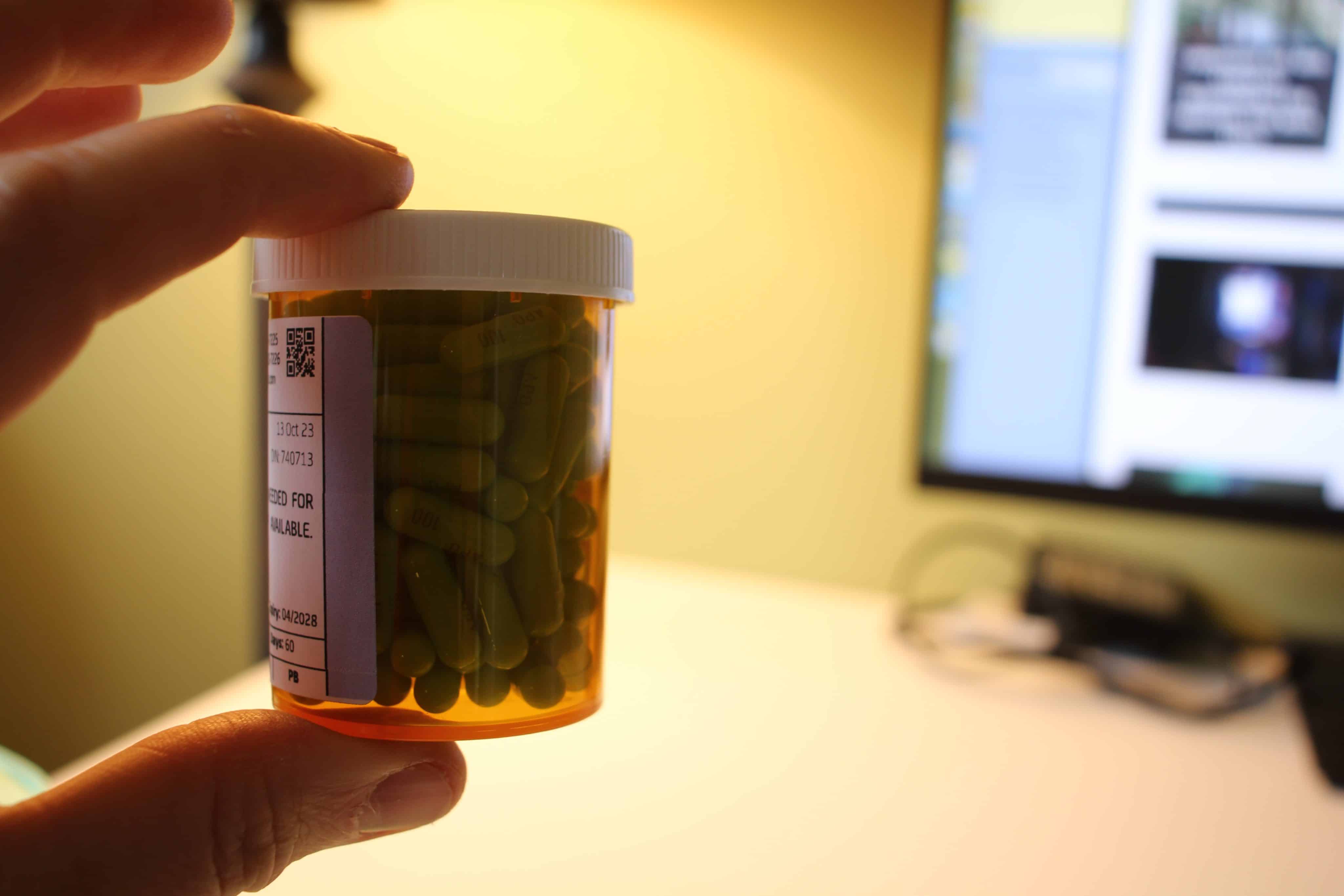 Green Medical Pills In Bottle